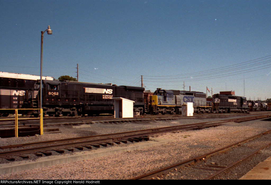 NS 8062 leads power away from a train